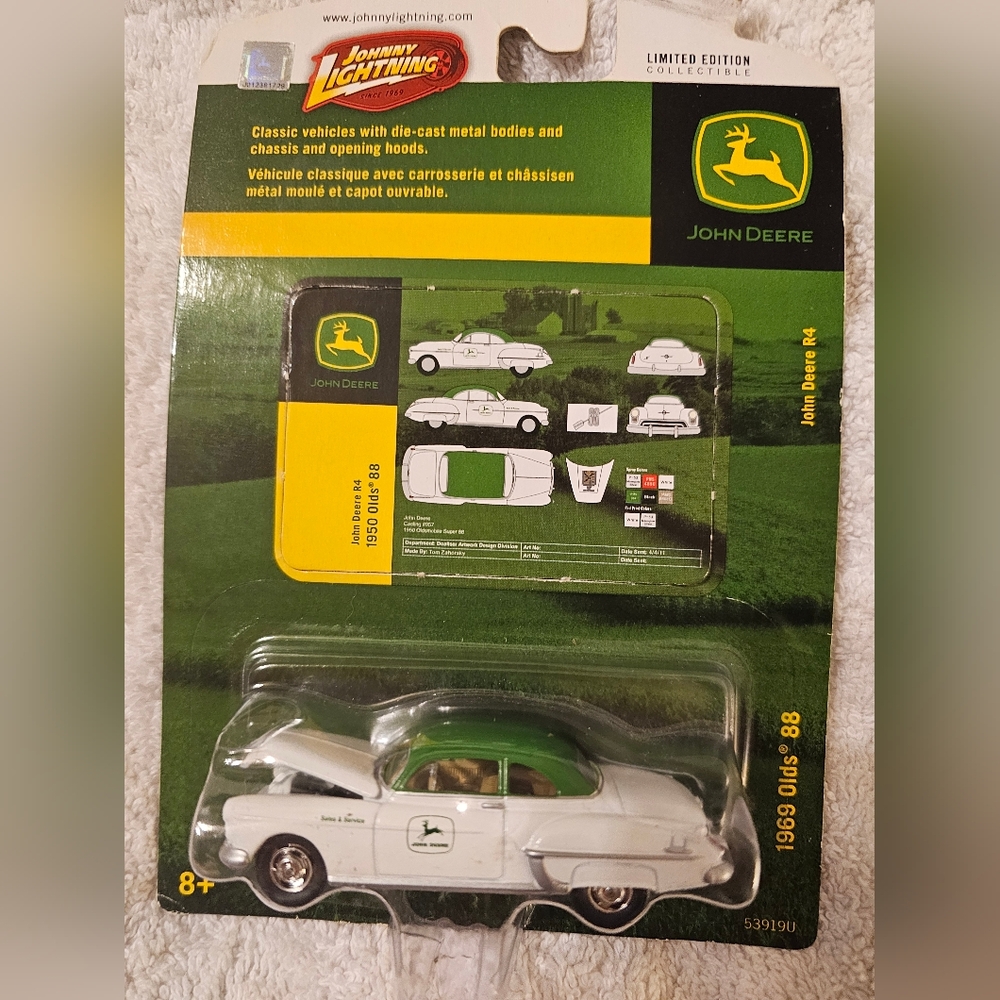 Rare Collectible with Packaging Error. Johnny Lightning John Deere Olds 88 1:64